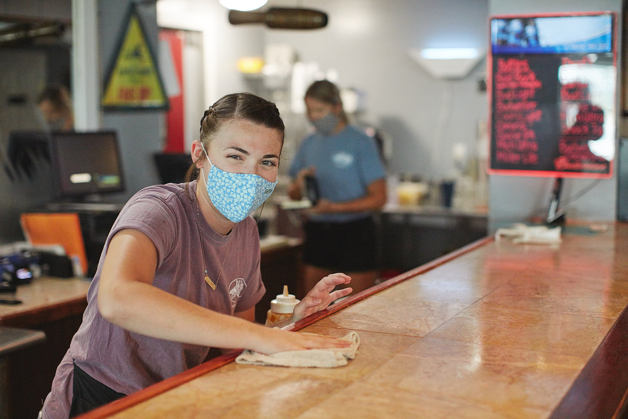 girl cleaning counter